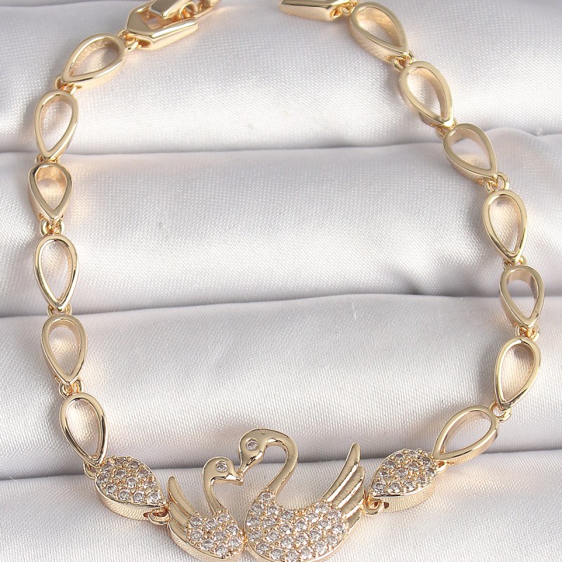 Pirinç Gold Renk Zirkon Taşlı Kuğu Figür Damla Zincir Model Kadın Bileklik Pirinç Gold Renk Zirkon Taşlı Kuğu Figür Damla Zincir Model Kadın Bileklik