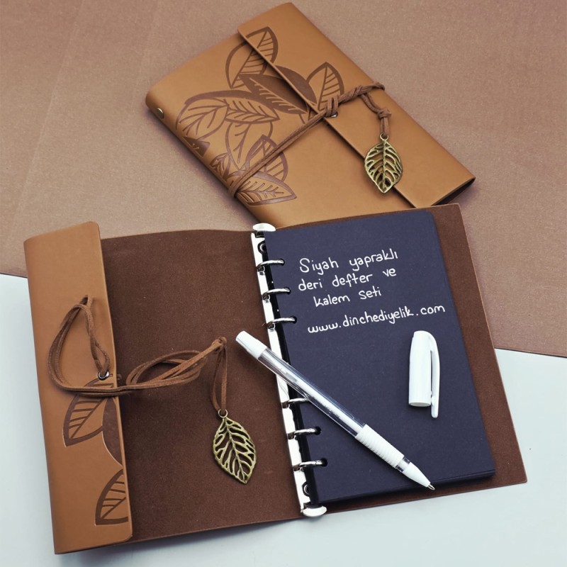 Siyah Yapraklı Deri Defter Ve Beyaz Jel Kalem Seti Siyah Yapraklı Deri Defter Ve Beyaz Jel Kalem Seti